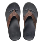 A pair of black and brown Reef Mens Cushion Bounce Phantom LE flip-flop sandals on a white background