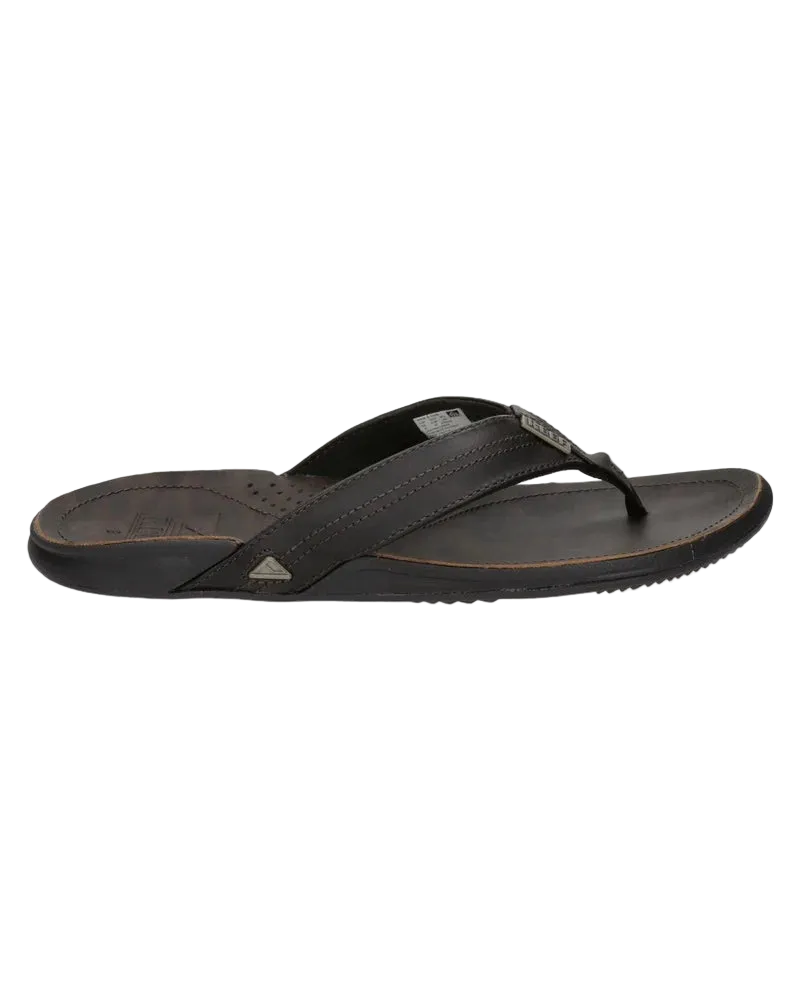 A black Reef Mens J-Bay III flip-flop sandal on a white background