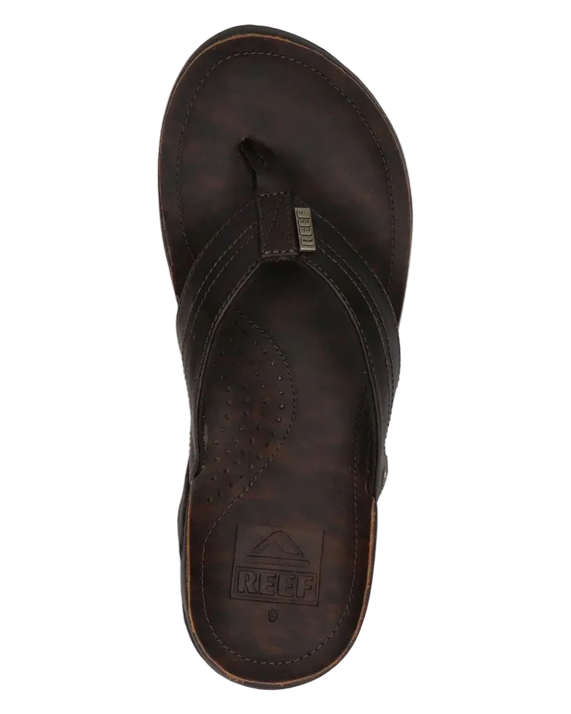 A black Reef Mens J-Bay III flip-flop sandal on a white background