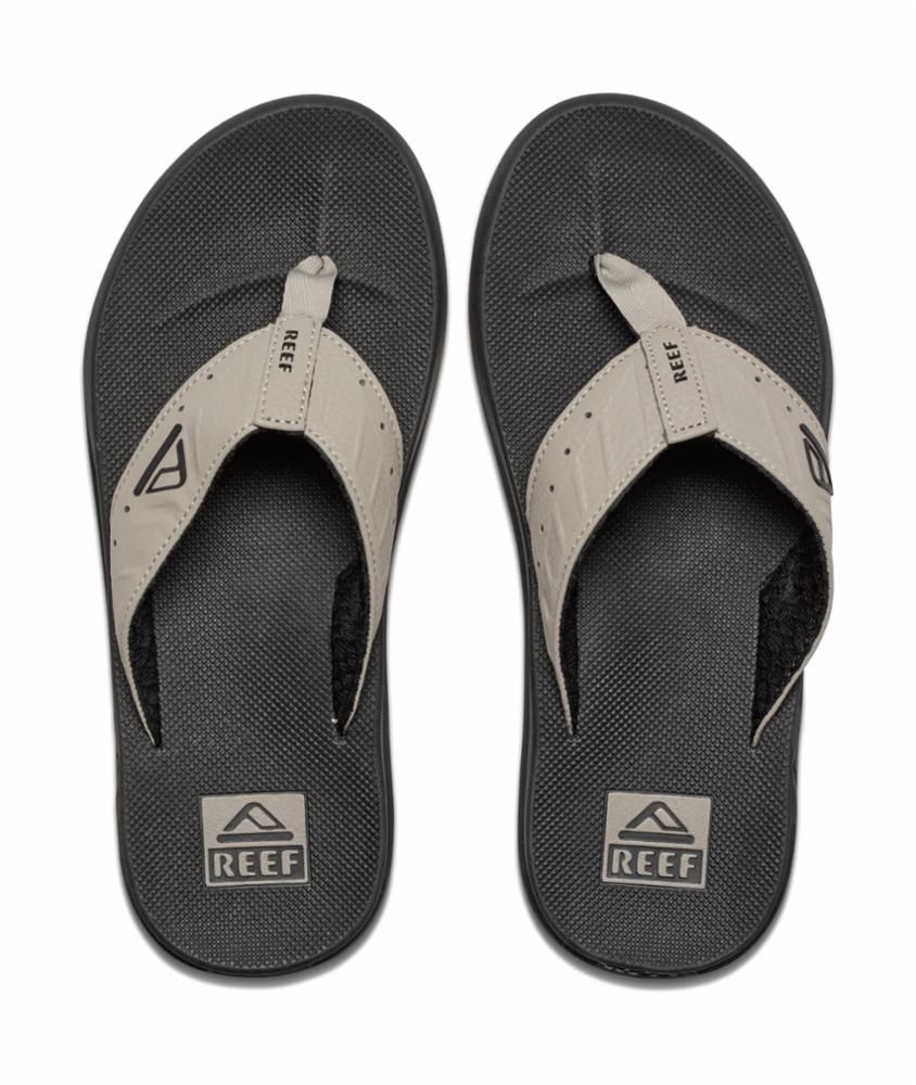 A pair of Black and beige Reef Mens Phantoms sandal on a white background