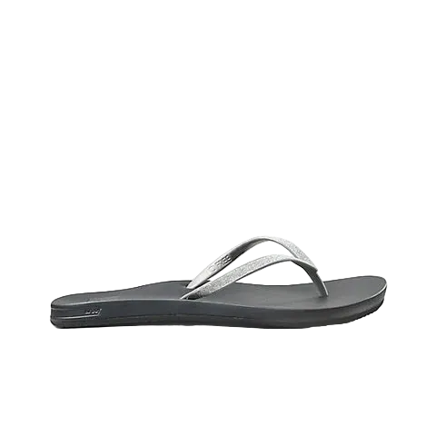 A Reef Women's Cushion Bounce Stargazer flip-flop sandal in black and silver