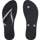 A pair of Reef Women's Cushion Bounce Stargazer flip-flop sandal in black and silver
