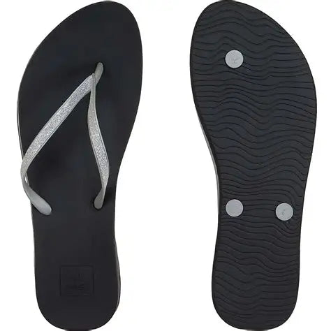 A pair of Reef Women's Cushion Bounce Stargazer flip-flop sandal in black and silver