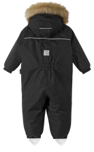 Reima JR Gotland One-Piece Ski Suit featuring waterproof construction, lightweight insulation, detachable hood, reinforced knees, and full-body winter protection.