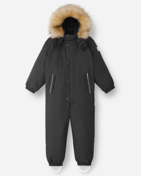 Reima JR Stavanger One-Piece Ski Suit featuring waterproof construction, lightweight insulation, detachable hood, reinforced knees, and full-body winter protection.