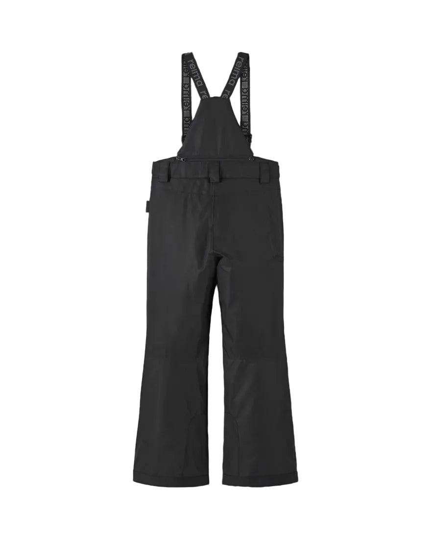 Rear view of black Reima Jr Wingon Pants featuring a waterproof Reimatec shell, detachable elastic suspenders, reinforced knee and hem panels, and zippered hand pockets.