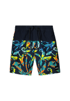 Black Reima Junior Papaija Swim Shorts with a colorful tropical pattern on a white background