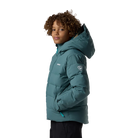 Side view of a blue Rossignol Jr Boys’ Siz Quilted Jacket featuring high-loft synthetic insulation, quilted baffle construction, DWR-treated shell, high stand-up collar, and zippered handwarmer pockets.
