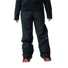 A boy wearing a pair of black Rossignol Boys' Ski Pants that are waterproof, breathable, stretchable, and insulated.