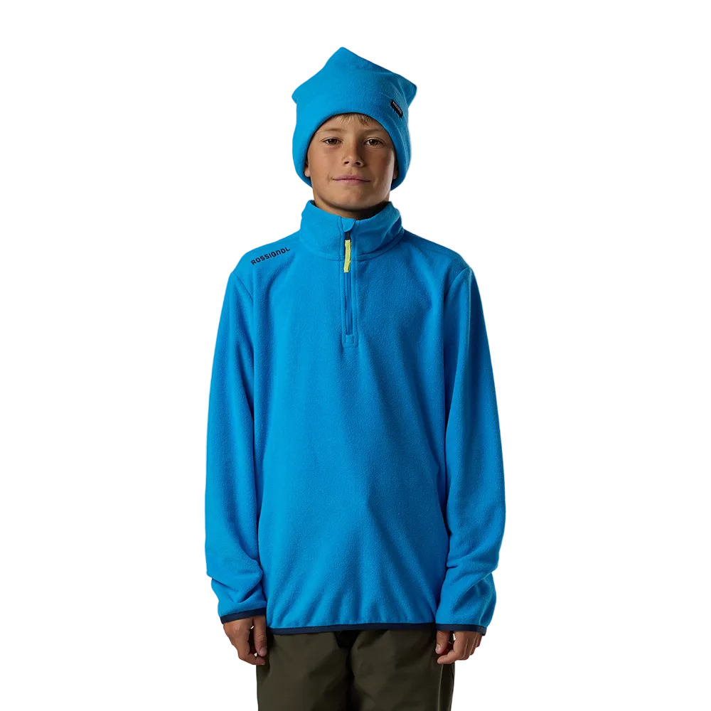 Front view of a blazing blue Rossignol Jr 1/4 Zip Polar Fleece featuring high-density microfleece construction, deep 1/4 zip front closure, and an ergonomic stand-up collar.