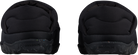Rear view of a black Rossignol Men’s Chalet Shoes featuring a water-resistant insulated upper, slip-on design with heel pull tab, cushioned EVA midsole, and high-grip rubber outsole.