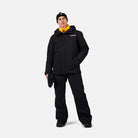 A man wearing a black Rossignol Men's Desafio 2L Shell Ski Jacket that is waterproof, stretchable, and breathable.