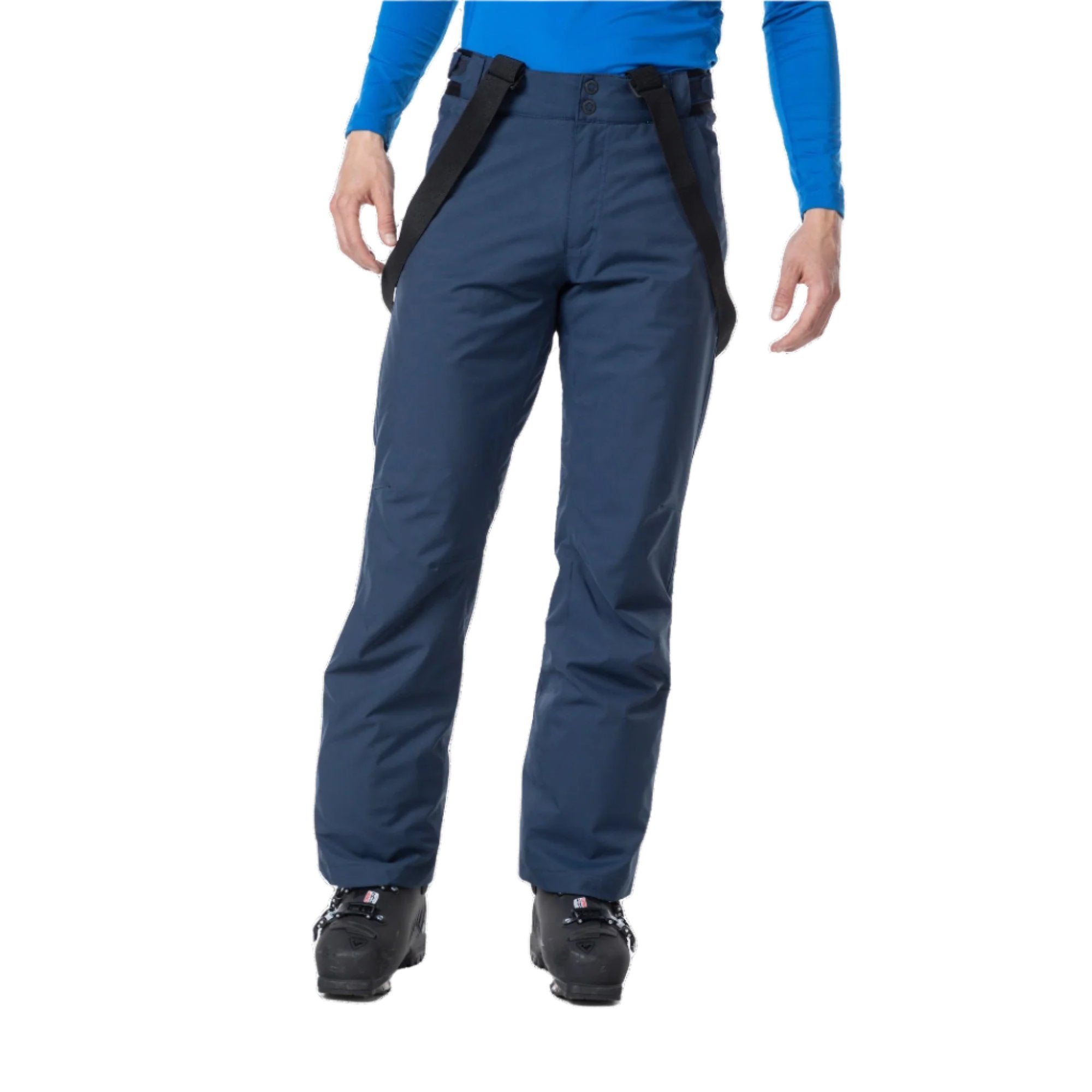 A man wearing a pair of navy blue Rossignol Men's Ski Pants that are waterproof, breathable, stretchable, and insulated.