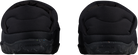 Rear view of a black/grey Rossignol Women’s Chalet Shoes featuring a water-resistant insulated upper, slip-on stretch cuff with heel pull tab, cushioned EVA midsole, and high-traction rubber outsole.