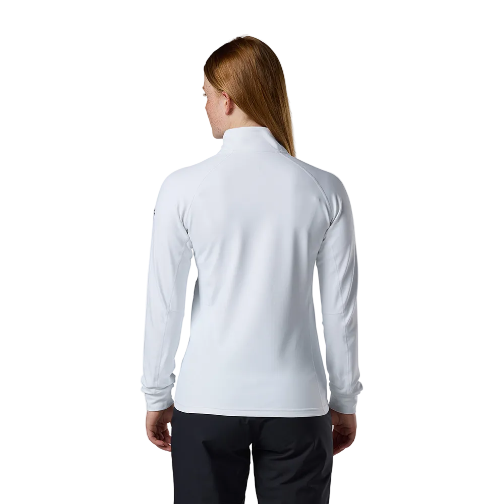 Rear view of a white Rossignol Women’s Midlayer Stretch Jacket featuring multi-directional stretch fabric, a thermal fleece interior, full-length front zipper, and zippered hand pockets.