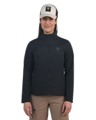 A woman wearing a black Rossignol Women's Opside Jacket that is water-resistant, breathable, stretchable, insulated, and lightweight.