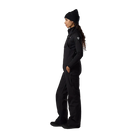 Side view of black Rossignol Women’s Outerlimits Insulated Bib Pants featuring high-chest bib construction, waterproof membrane fabric, adjustable suspenders, zippered inner thigh vents, integrated boot gaiters, and reinforced hem scuff guards.