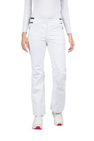  A woman wearing a pair of white Rossignol Women's Ski Pants that are waterproof, breathable, stretchable, and insulated.