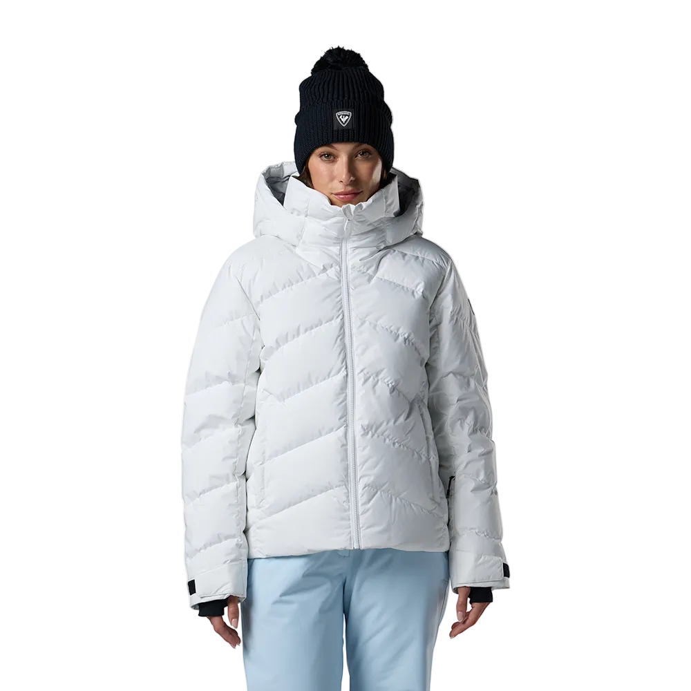 Front view of a white Rossignol Women’s Wispile Ripstop Down Jacket featuring high-loft baffled down insulation, durable ripstop outer fabric, insulated hood, and zippered handwarmer pockets.