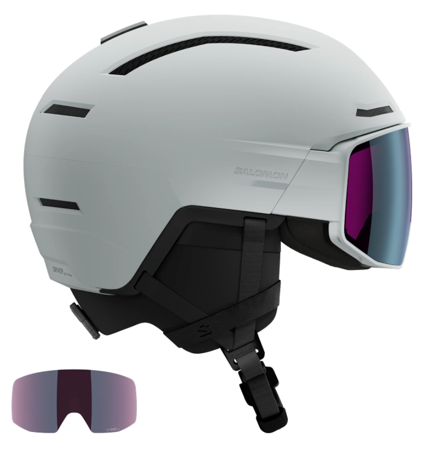Salomon Driver Prime Sigma Plus Mips Helmet showing a hybrid shell with top ventilation ports, an integrated mirrored visor lens with a gradient tint, padded ear covers, and an adjustable chin strap system.