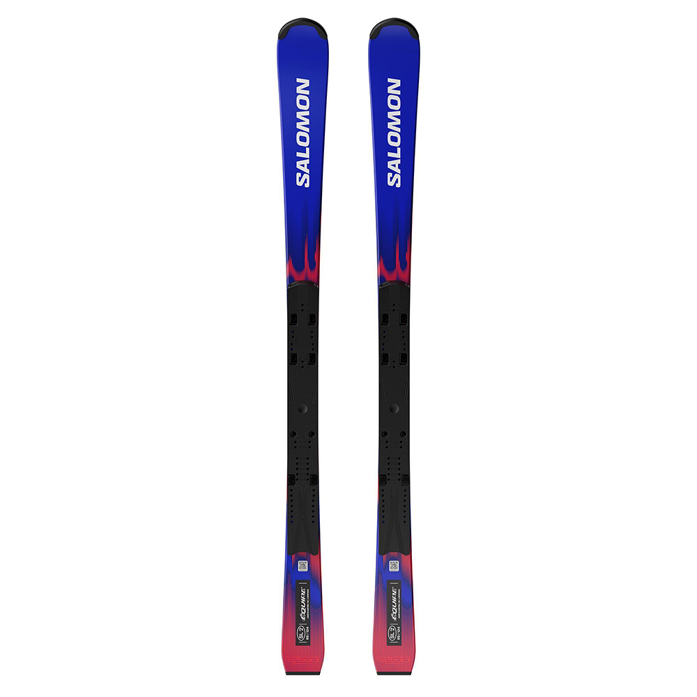 A pair of Salomon Ni Equipe FIS SL Jr 124-138 race skis shown vertically, featuring a blue and black design with pink flame-like accents and white Salomon branding.