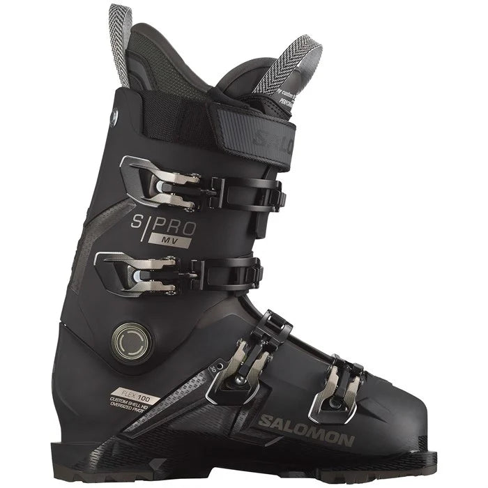 A black Salomon S/Pro MV 100 ski boot designed for all-mountain use. The image shows the side profile of the boot highlighting its sturdy build and multiple buckle closures.