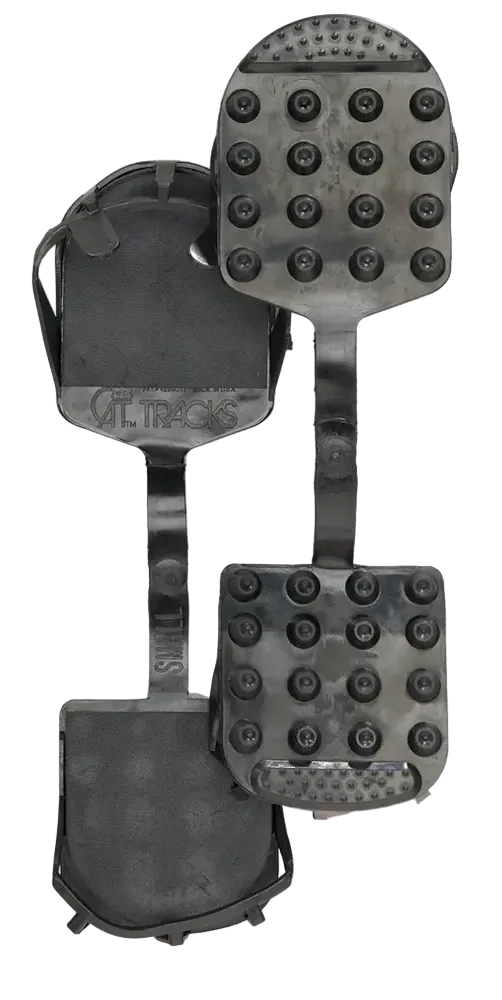 Seirus Cat Tracks in black showing flexible cold-resistant rubber construction, high-traction tread pattern, contoured heel-and-toe boot lug grips, and compact rollable design.