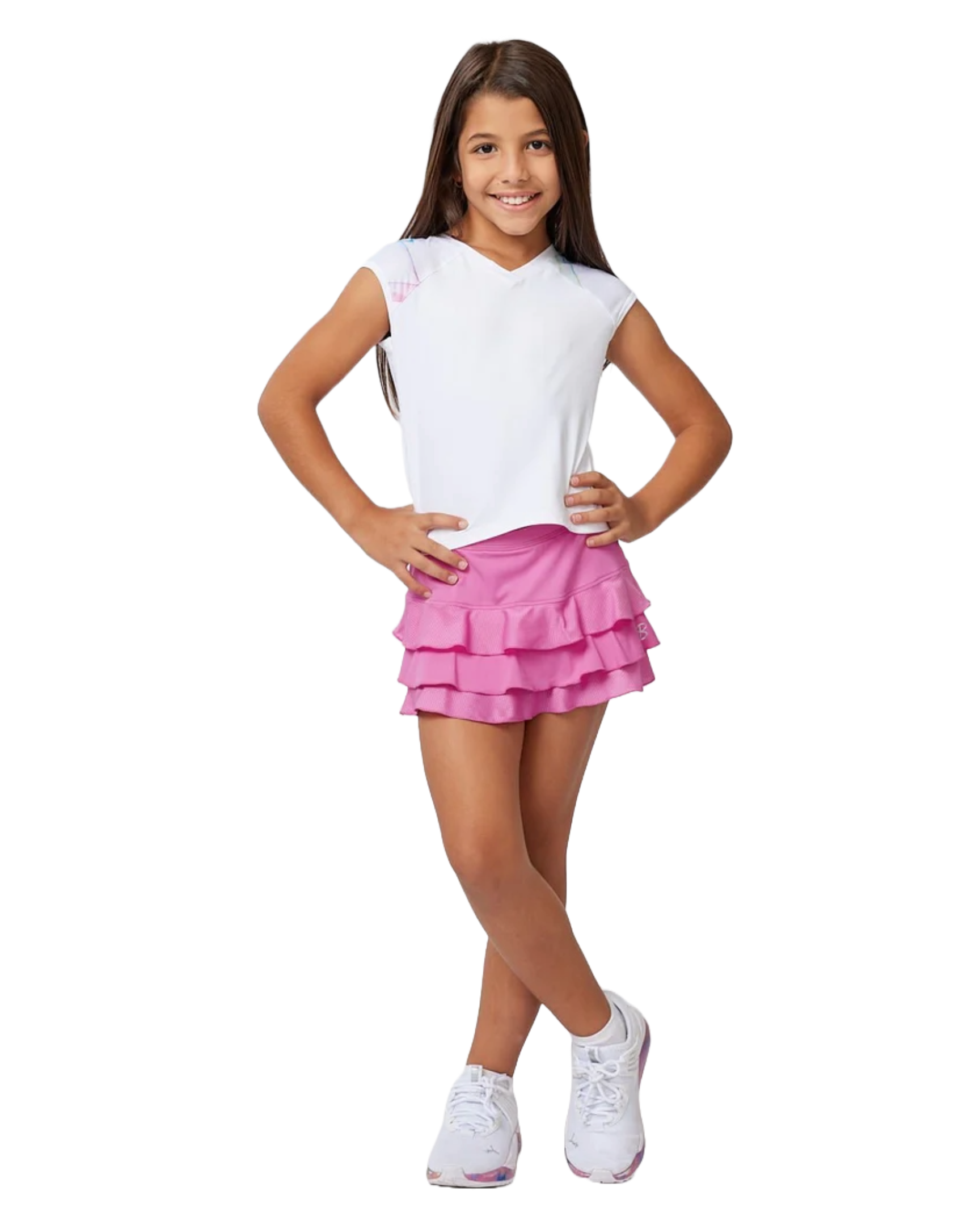 A girl wearing a white Sofibella Girls Spectrum Raglan Cap Sleeve Top and a pink skirt on a white background.