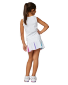 A girl wearing a white Sofibella Girls Spectrum Tank Top and skirt on a white background.