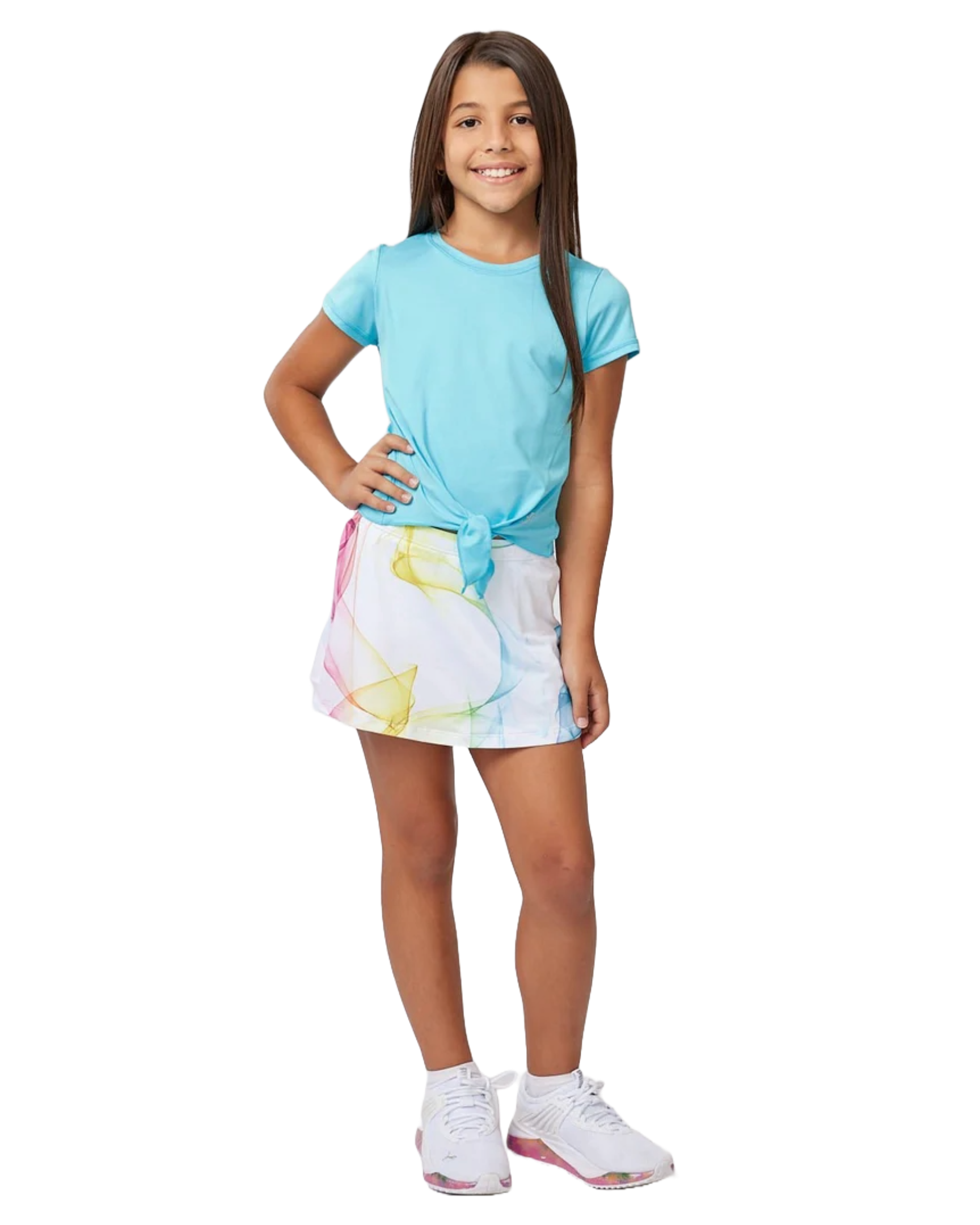 A girl wearing a white Sofibella Girls Spectrum UV Skort with a multicolour design on a white background.