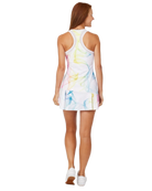 A woman wearing a Sofibella Women's Spectrum 32" Dress that features a fun multicolour design that's made from moisture-wicking, quick-drying, and stretchable fabric.
