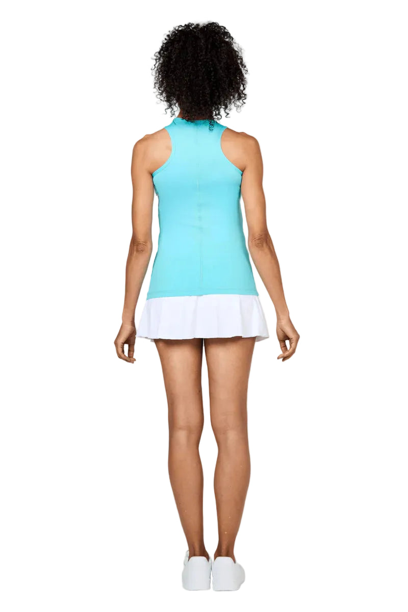 Woman wearing a light blue Sofibella Women's UV Colours Racerback Tank Top and white skirt on a white background