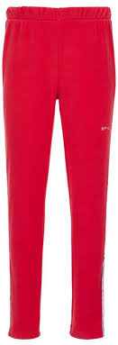 A pair of pink Spyder Girls' Speed Fleece Pants with elastic waistband and tapered ankles, featuring an embroidered Spyder logo.