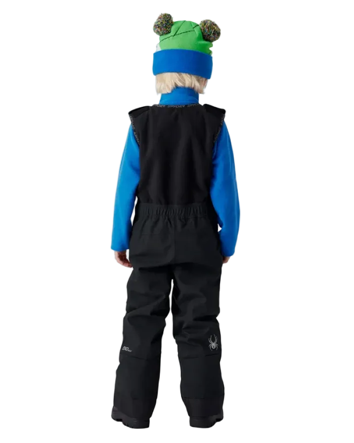 A child wearing a Spyder Toddler Expedition Pants featuring EXO SHIELD stretch waterproof-breathable shell, taped seams, adjustable shoulder straps, and attached stretch fleece vest.