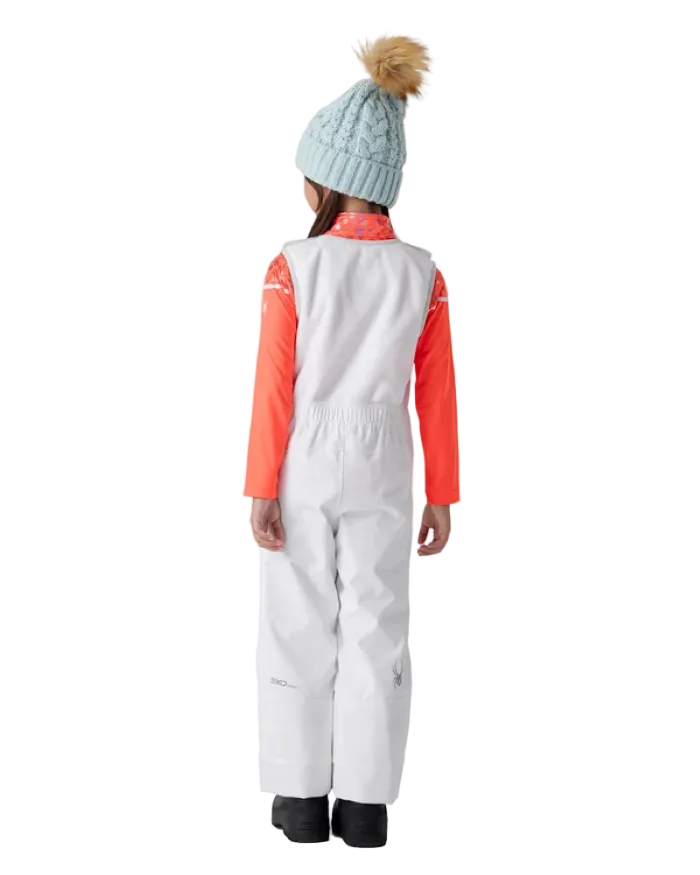 A child wearing a Spyder Toddler Expedition Pants featuring EXO SHIELD stretch waterproof-breathable shell, taped seams, adjustable shoulder straps, and attached stretch fleece vest.