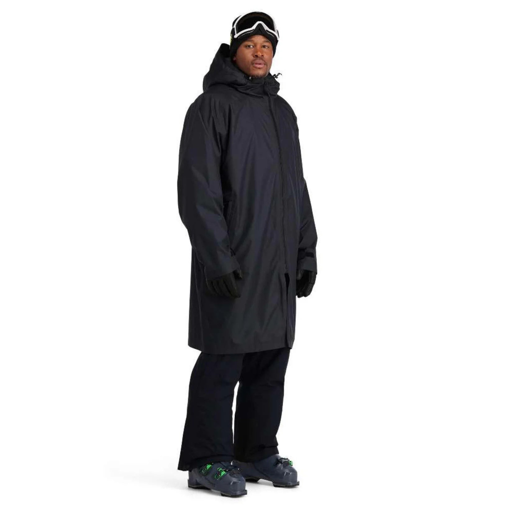 A man wearing a black Spyder Rain Shell Jacket that is waterproof and stretchable.