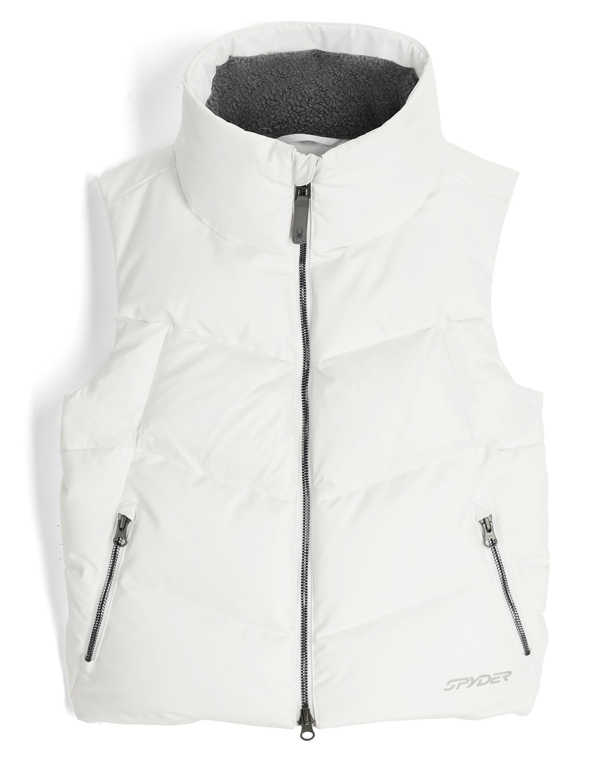 A white Spyder Women's Eastwood Down Vest that is waterproof, breathable, stretchable, and insulated with down.