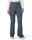 A woman wearing a pair of grey Spyder Women's Fuse Ski Pants that are waterproof, breathable, stretchable, and warm.