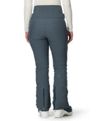 A woman wearing a pair of grey Spyder Women's Fuse Ski Pants that are waterproof, breathable, stretchable, and warm.