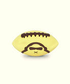 Yellow Sun Bum football with a Sun Bum logo on a white background