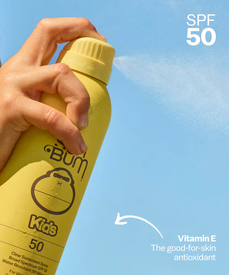 Yellow Sun Bum Kids SPF 50 Clear Sunscreen spray bottle on a blue background