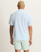 Tommy Bahama Men's Bahama Coast Pina Islands Golf Polo featuring a tropical print, performance stretch fabric, and classic polo styling.