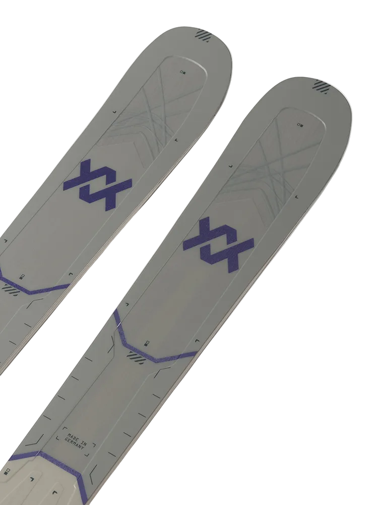 A pair of white and purple 2027 Volkl Mantra 84 W skis that are designed for advanced female skiers.