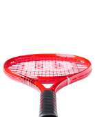 A red Wilson Defyer 100L V1 tennis racket that features a lightweight design and is designed for spin.