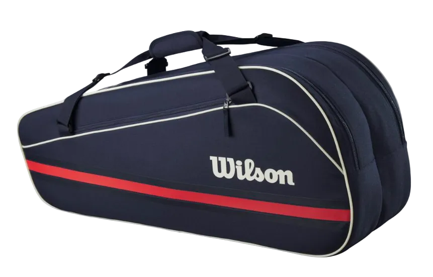 A navy blue Wilson Team 6 Pack racket bag that is designed to hold up to 6 tennis rackets.