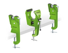 A Wintersteiger Ski Vise Racing showing three-piece heavy-duty green aluminum cast bodies, adjustable central clamping jaw with wide rubber grip pads, threaded workbench mounting screws, and two end supports featuring integrated brake retainers.