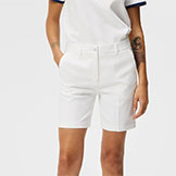 J.Lindegerg Women's Gwen Long Golf Shorts White available at Swiss Sports Haus 604-922-9107.